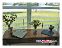 JCHolidays side table with useful info for your vacation